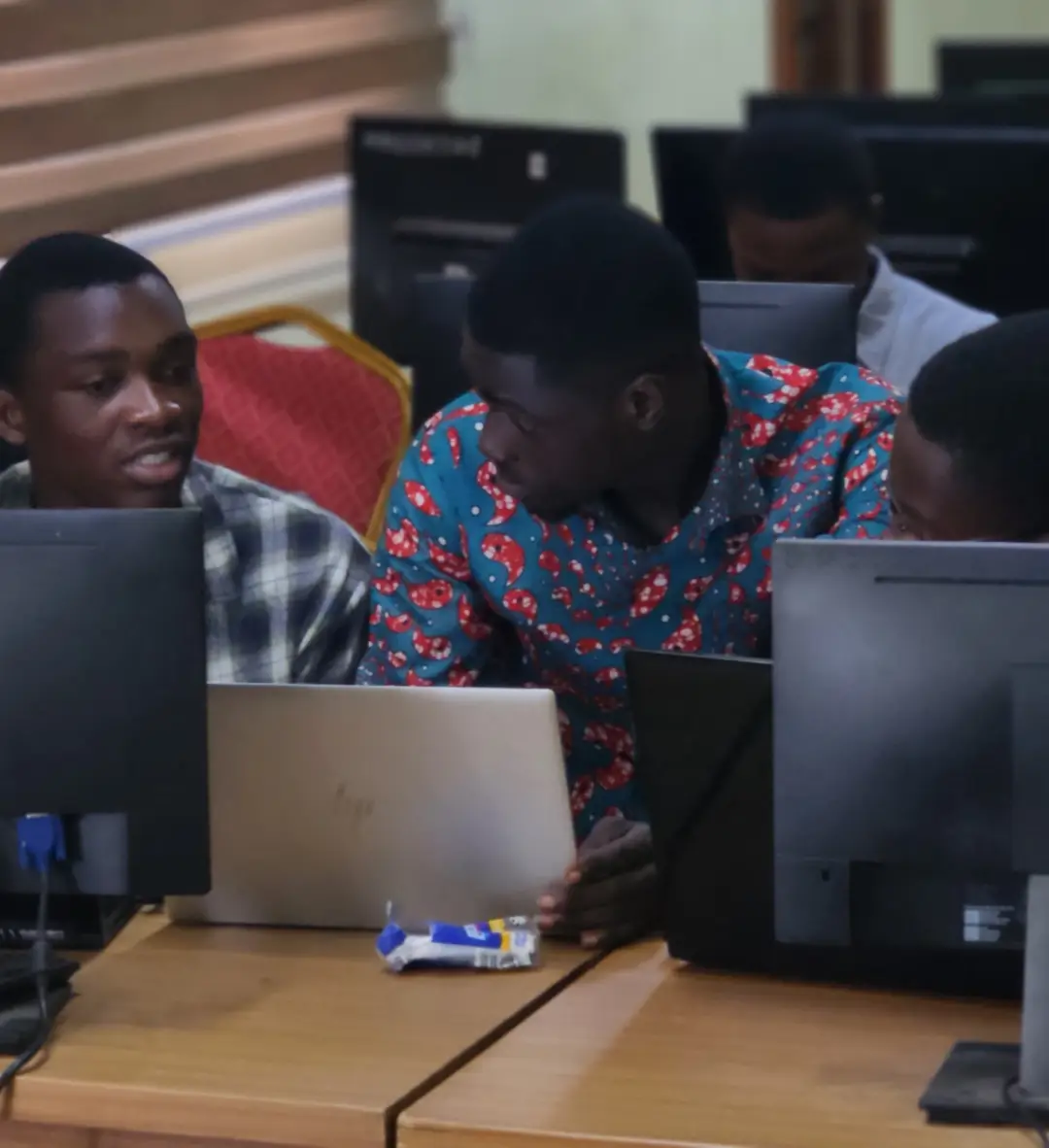 UMaT pre-hackathon 2026: students collaborating on a laptop