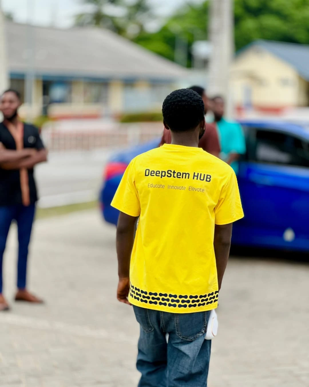 DeepStem Hub delegate in a yellow DeepStem shirt at YICGG 2025